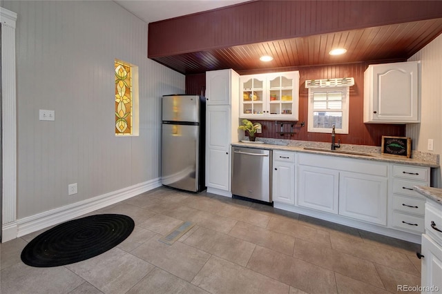 114 N 7th St, Colorado Springs, CO 80905 - kitchen featuring a sink, appliances with stainless steel finishes, wooden ceiling, and glass insert cabinets