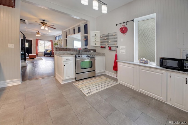 114 N 7th St, Colorado Springs, CO 80905 - kitchen with ceiling fan, black microwave, stainless steel electric range, baseboards, and white cabinets