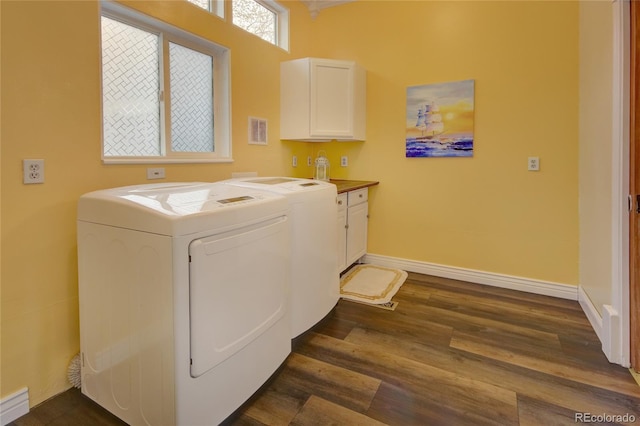 114 N 7th St, Colorado Springs, CO 80905 - laundry area featuring visible vents, cabinet space, dark wood finished floors, and washing machine and clothes dryer