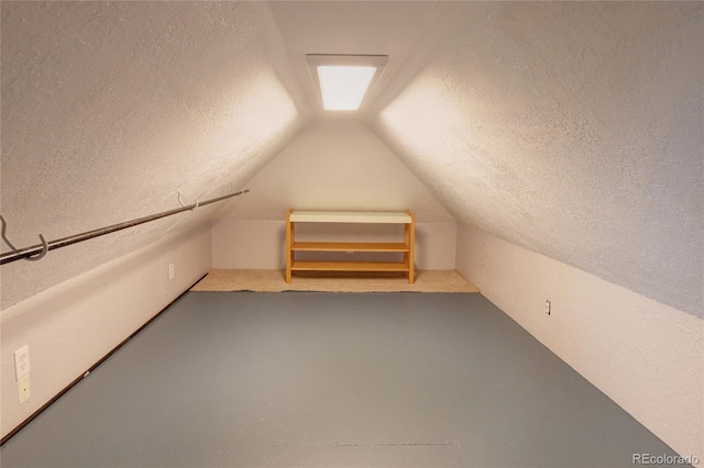 114 N 7th St, Colorado Springs, CO 80905 - bonus room with finished concrete floors, a textured ceiling, and vaulted ceiling