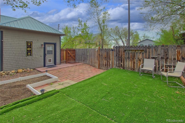 114 N 7th St, Colorado Springs, CO 80905 - view of yard featuring a patio and a fenced backyard