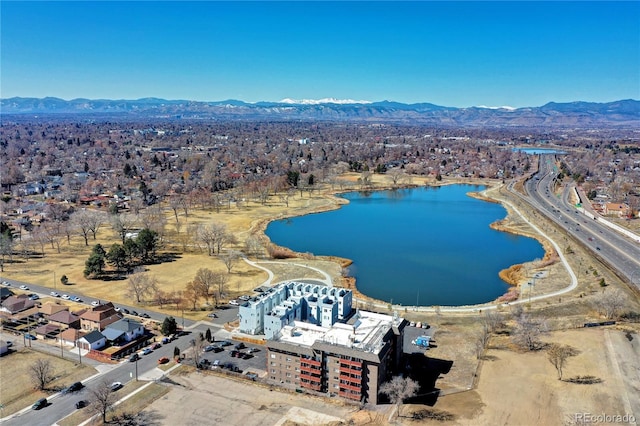 drone / aerial view with a water and mountain view