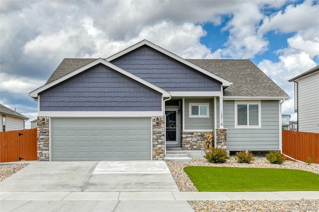 12718 Windingwalk Dr, Peyton, CO 80831 - craftsman inspired home with an attached garage, stone siding, concrete driveway, and a shingled roof