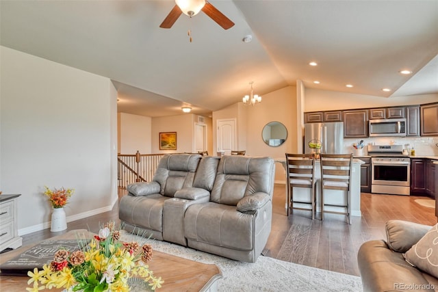 12718 Windingwalk Dr, Peyton, CO 80831 - living area featuring ceiling fan, vaulted ceiling, a chandelier, light wood finished floors, and recessed lighting