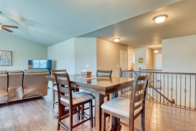 12718 Windingwalk Dr, Peyton, CO 80831 - dining space featuring a ceiling fan, wood-type flooring, and vaulted ceiling