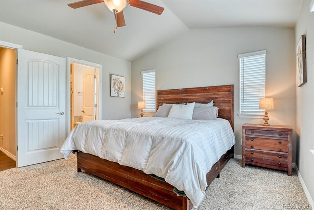12718 Windingwalk Dr, Peyton, CO 80831 - bedroom with vaulted ceiling, carpet flooring, multiple windows, and ensuite bathroom