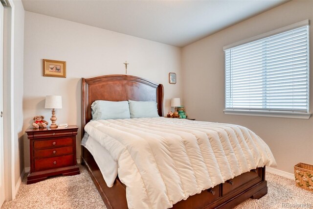 12718 Windingwalk Dr, Peyton, CO 80831 - carpeted bedroom with multiple windows and baseboards