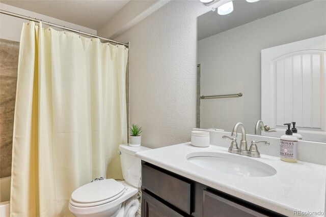 12718 Windingwalk Dr, Peyton, CO 80831 - full bathroom with toilet, vanity, and a textured wall