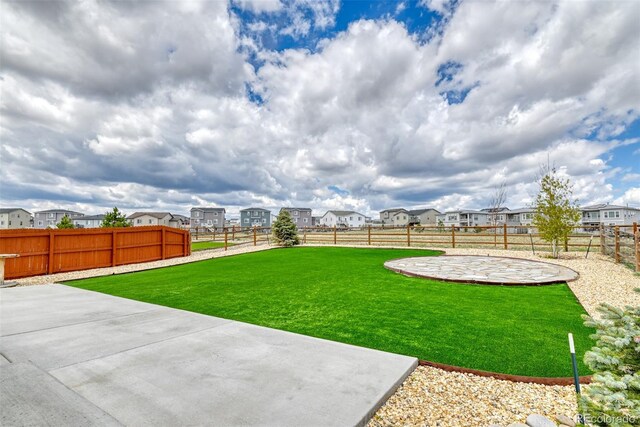 12718 Windingwalk Dr, Peyton, CO 80831 - view of yard featuring a patio and a residential view