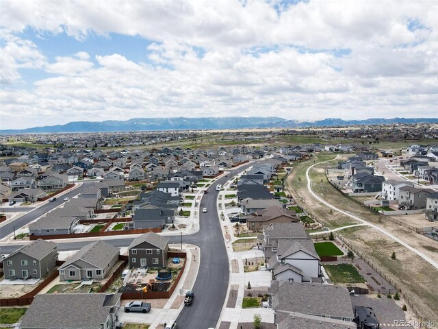 12718 Windingwalk Dr, Peyton, CO 80831 - aerial view of residential area with a mountain backdrop
