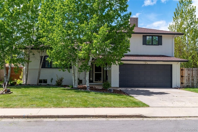 view of property hidden behind natural elements with a garage and a front lawn