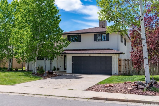 view of front property with a front lawn and a garage