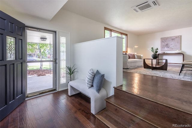 entryway featuring a wealth of natural light and dark hardwood / wood-style flooring