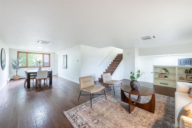 sitting room with dark hardwood / wood-style floors