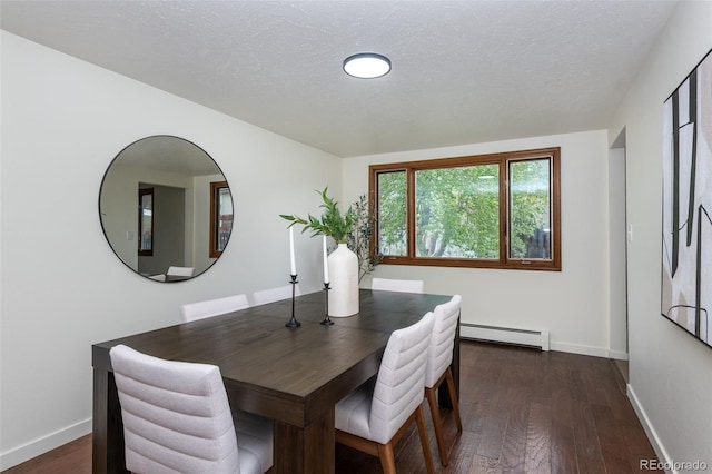 dining area with dark hardwood / wood-style floors, a baseboard radiator, and a textured ceiling