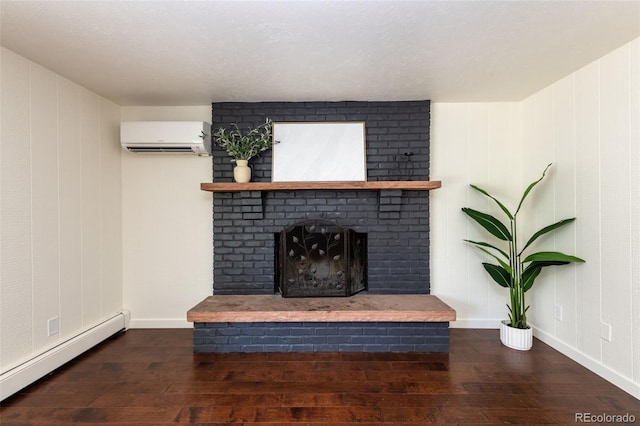 unfurnished living room featuring a fireplace, a wall mounted air conditioner, hardwood / wood-style flooring, and baseboard heating