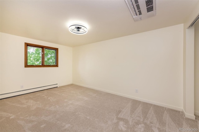 carpeted empty room featuring a baseboard radiator