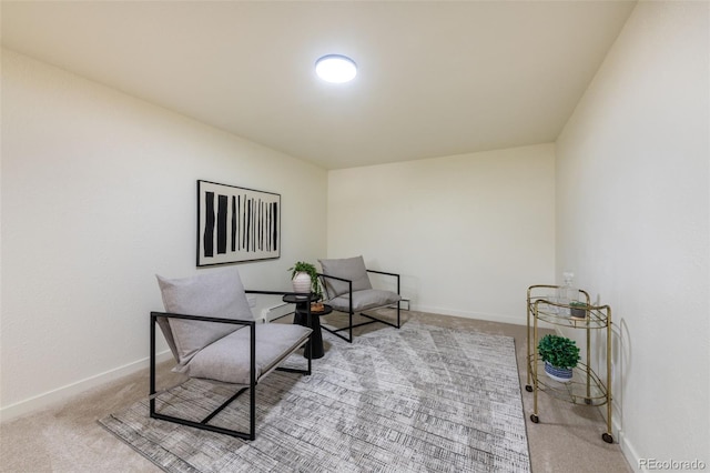 living area featuring light colored carpet