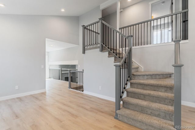 4740 W 108th Pl, Westminster, CO 80031 - staircase with wood finished floors, recessed lighting, and a high ceiling