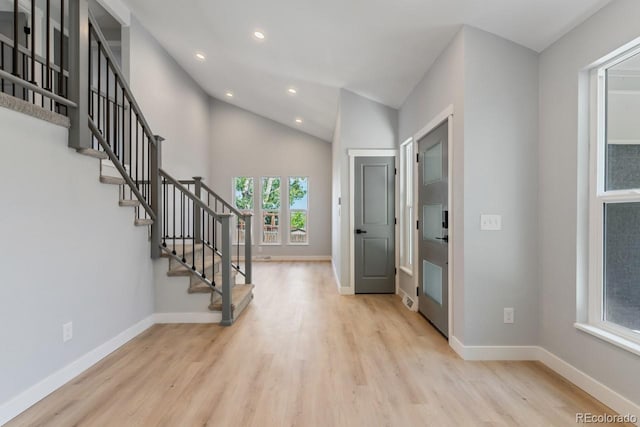 4740 W 108th Pl, Westminster, CO 80031 - foyer entrance featuring wood finished floors, recessed lighting, stairway, and vaulted ceiling