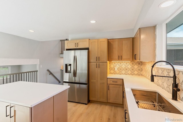 4740 W 108th Pl, Westminster, CO 80031 - kitchen with stainless steel fridge with ice dispenser, plenty of natural light, light countertops, backsplash, and recessed lighting
