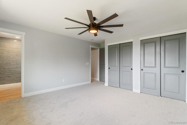 4740 W 108th Pl, Westminster, CO 80031 - unfurnished bedroom with two closets, light carpet, ensuite bath, and a ceiling fan