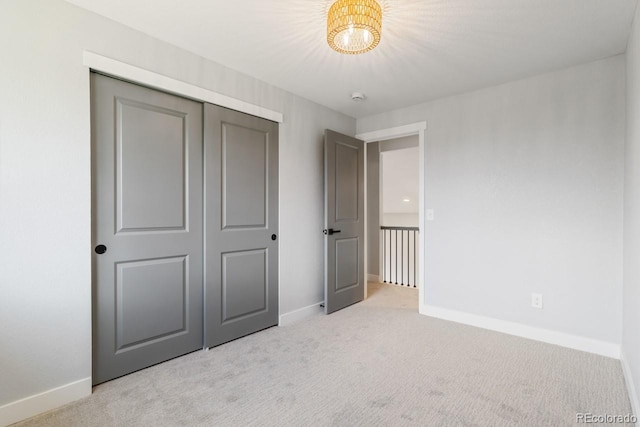 4740 W 108th Pl, Westminster, CO 80031 - unfurnished bedroom featuring light carpet, a chandelier, and a closet