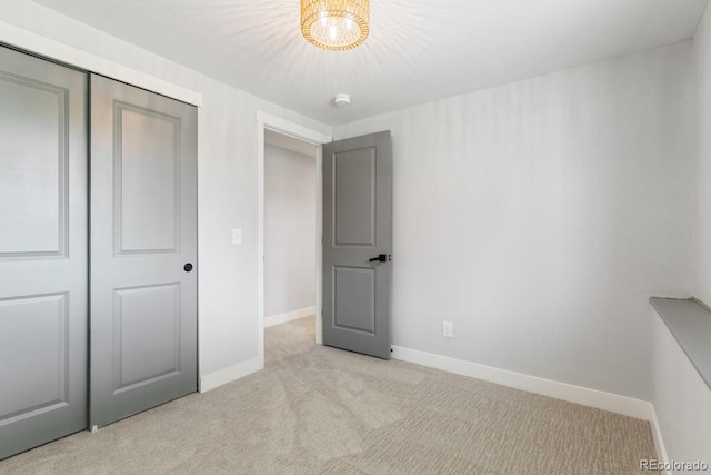 4740 W 108th Pl, Westminster, CO 80031 - unfurnished bedroom with light colored carpet, a closet, and a chandelier