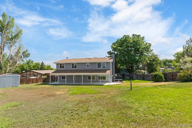 4740 W 108th Pl, Westminster, CO 80031 - rear view of house featuring a storage shed, a fenced backyard, and a patio area