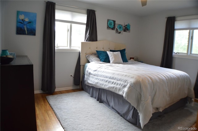 1158 E Easter Ct, Centennial, CO 80122 - bedroom featuring light wood-type flooring, ceiling fan, and baseboards
