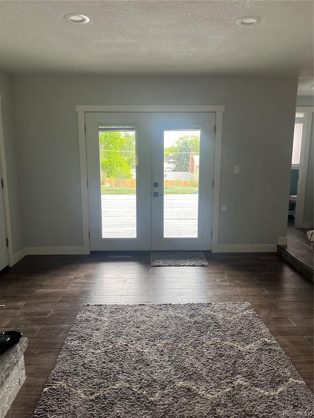 1158 E Easter Ct, Centennial, CO 80122 - entryway with healthy amount of natural light, french doors, a textured ceiling, baseboards, and recessed lighting