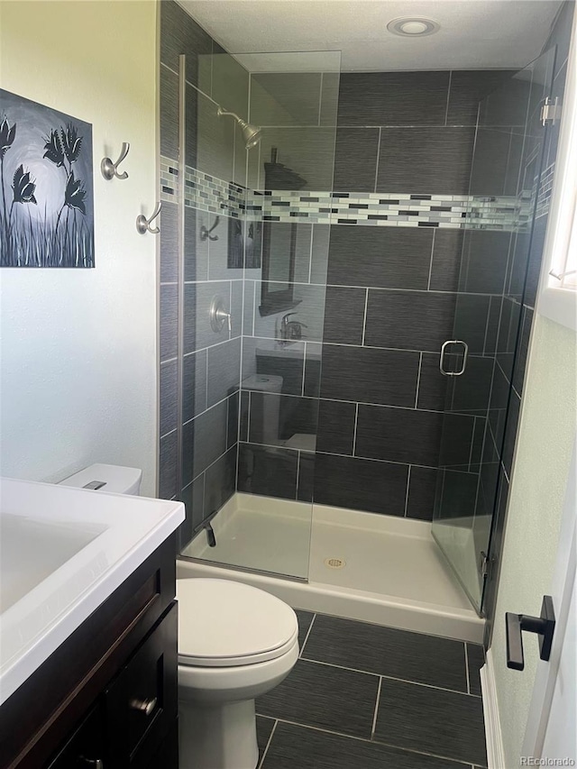 1158 E Easter Ct, Centennial, CO 80122 - full bath with toilet, vanity, a stall shower, and tile patterned floors
