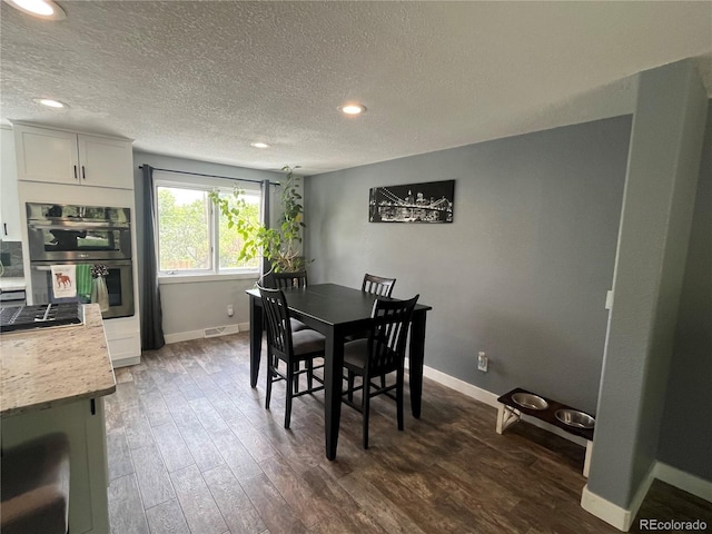 1158 E Easter Ct, Centennial, CO 80122 - dining area featuring dark wood-style flooring, baseboards, a textured ceiling, and recessed lighting