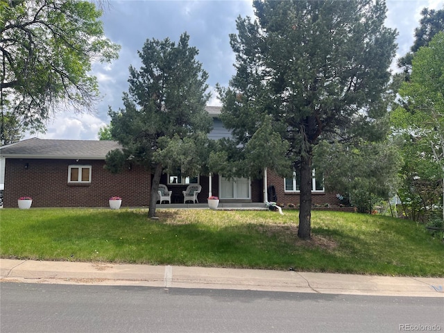 1158 E Easter Ct, Centennial, CO 80122 - view of property hidden behind natural elements with brick siding and a front lawn