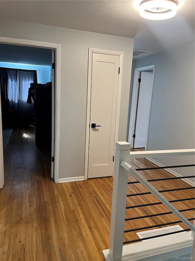 1158 E Easter Ct, Centennial, CO 80122 - corridor featuring wood finished floors and baseboards