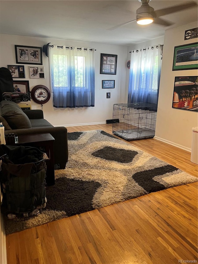 1158 E Easter Ct, Centennial, CO 80122 - living area with ceiling fan, wood finished floors, and baseboards