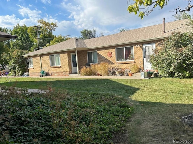 ranch-style home with a front yard