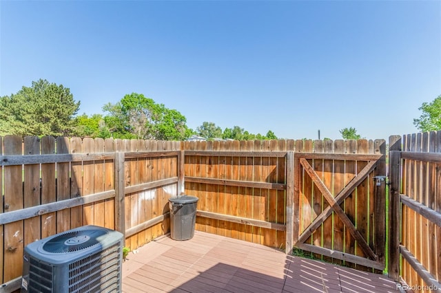 1622 S Idalia Cir Unit E, Aurora, CO 80017 - deck with central air condition unit and a gate