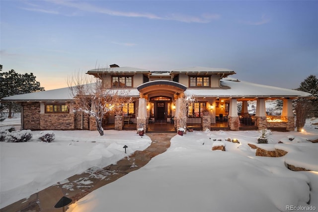 prairie-style home featuring a porch