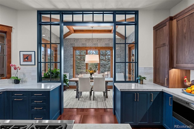 kitchen featuring decorative backsplash and blue cabinetry