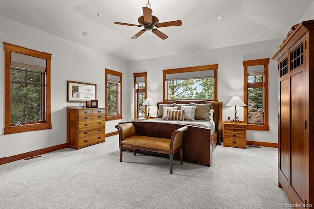 bedroom featuring light colored carpet and ceiling fan