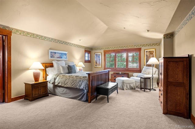 carpeted bedroom featuring vaulted ceiling