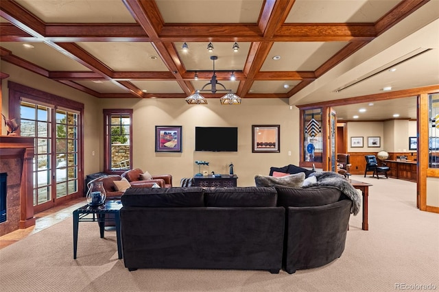 living room with beam ceiling, coffered ceiling, and a high end fireplace