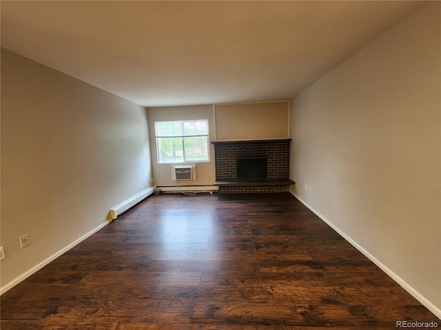 8330 Zuni St Unit 117, Denver, CO 80221 - unfurnished living room featuring dark wood-style flooring, a fireplace, baseboards, and a wall unit AC