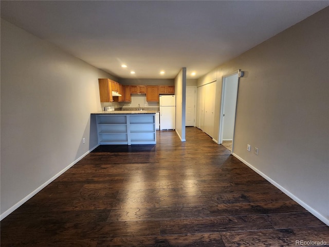8330 Zuni St Unit 117, Denver, CO 80221 - unfurnished living room featuring dark wood-type flooring, recessed lighting, and baseboards