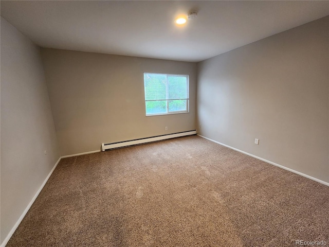 8330 Zuni St Unit 117, Denver, CO 80221 - carpeted spare room with a baseboard heating unit, baseboards, and a smoke detector