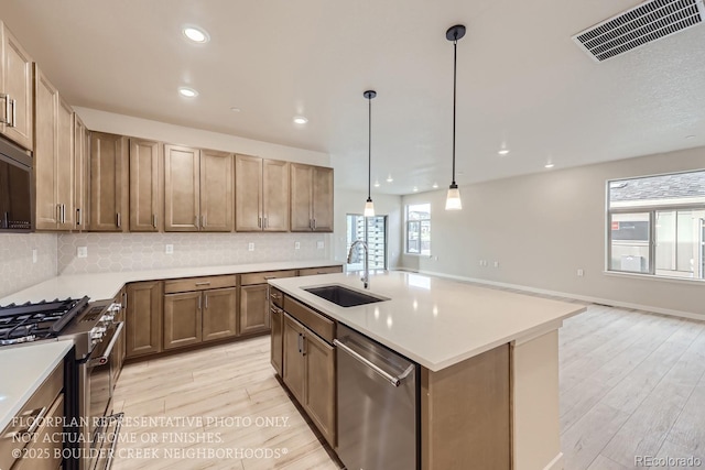 834 W 128th Pl, Westminster, CO 80234 - kitchen with plenty of natural light, stainless steel appliances, visible vents, and a sink