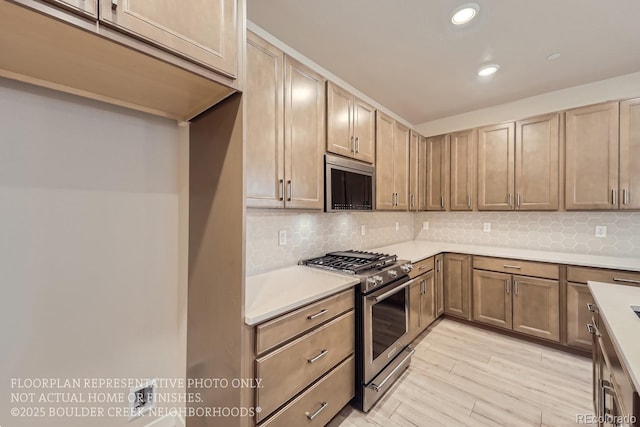 834 W 128th Pl, Westminster, CO 80234 - kitchen featuring decorative backsplash, appliances with stainless steel finishes, light countertops, and recessed lighting