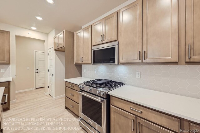 834 W 128th Pl, Westminster, CO 80234 - kitchen featuring recessed lighting, tasteful backsplash, light wood finished floors, and stainless steel appliances