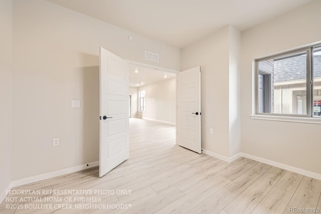 834 W 128th Pl, Westminster, CO 80234 - empty room featuring visible vents, light wood-style flooring, and baseboards